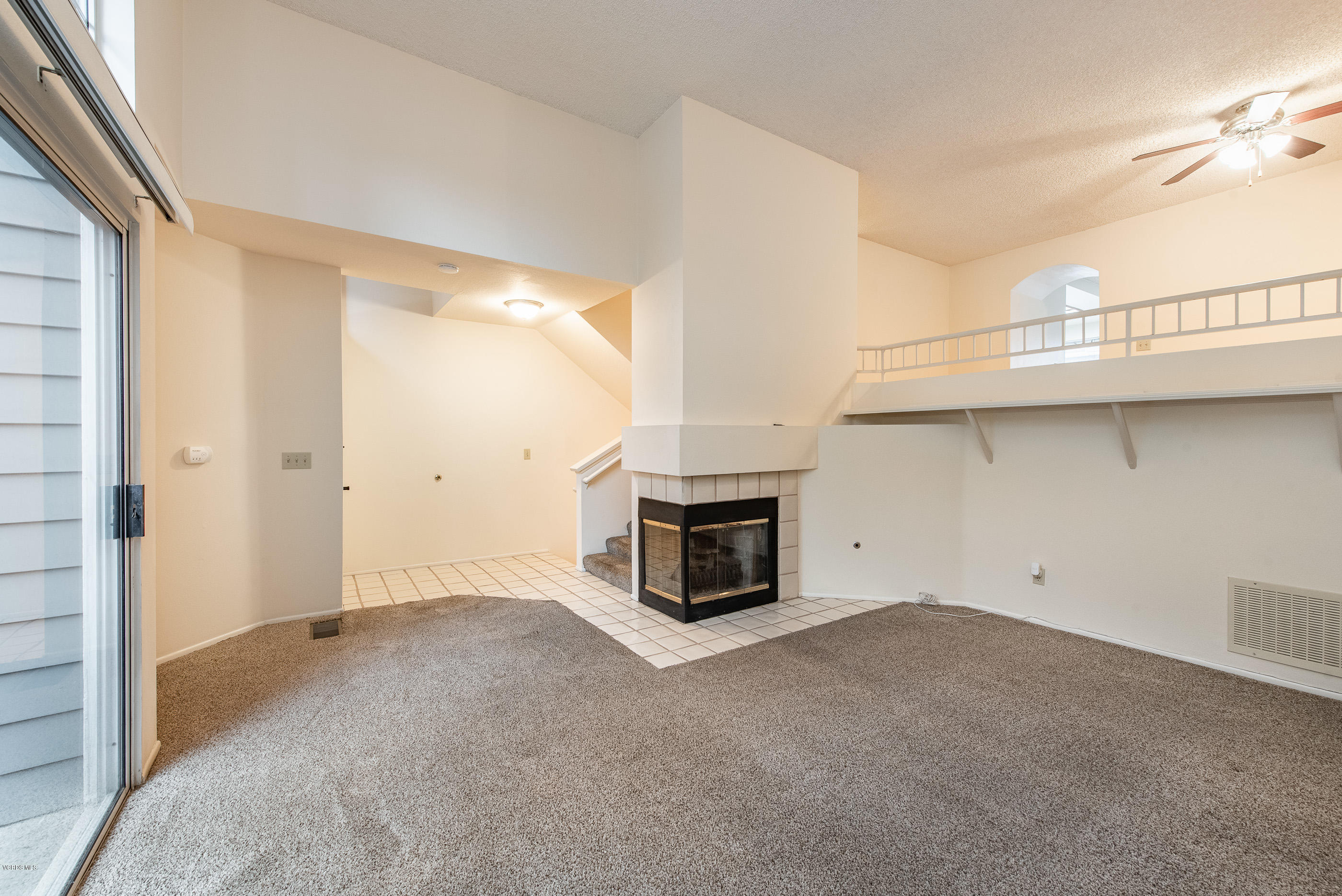 4975 Telephone Road Ventura, CA 93003 - Photo 6 of 31 a view of a livingroom with an empty space and a fireplace