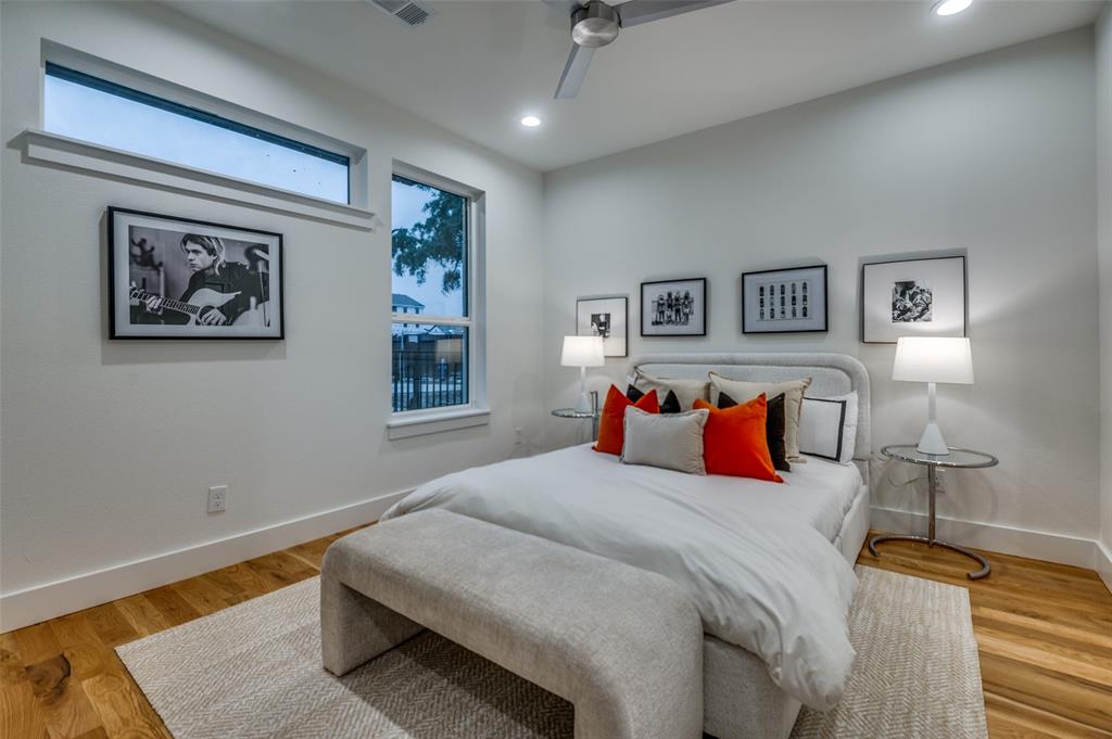 4133 North Reserve Lane Addison, TX 75001 - Photo 19 of 20 a bedroom with a bed and a painting on the wall