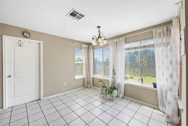 a spacious bathroom with a glass shower door and a bathtub