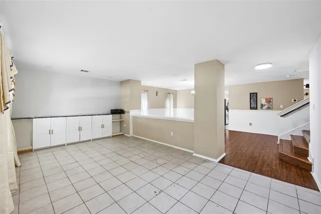 a view of a kitchen with furniture and cabinets