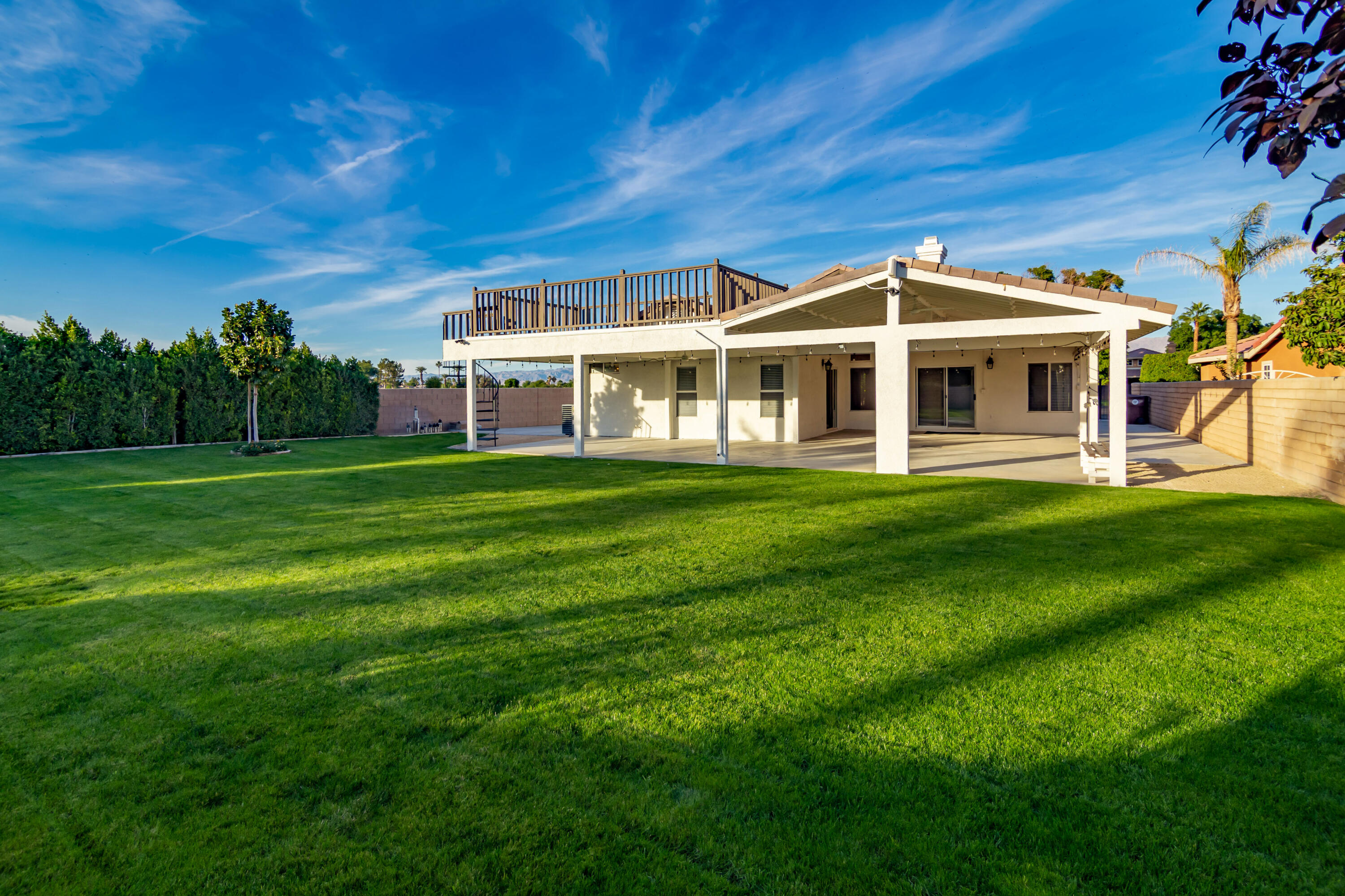 a front view of a house with a yard table and chairs