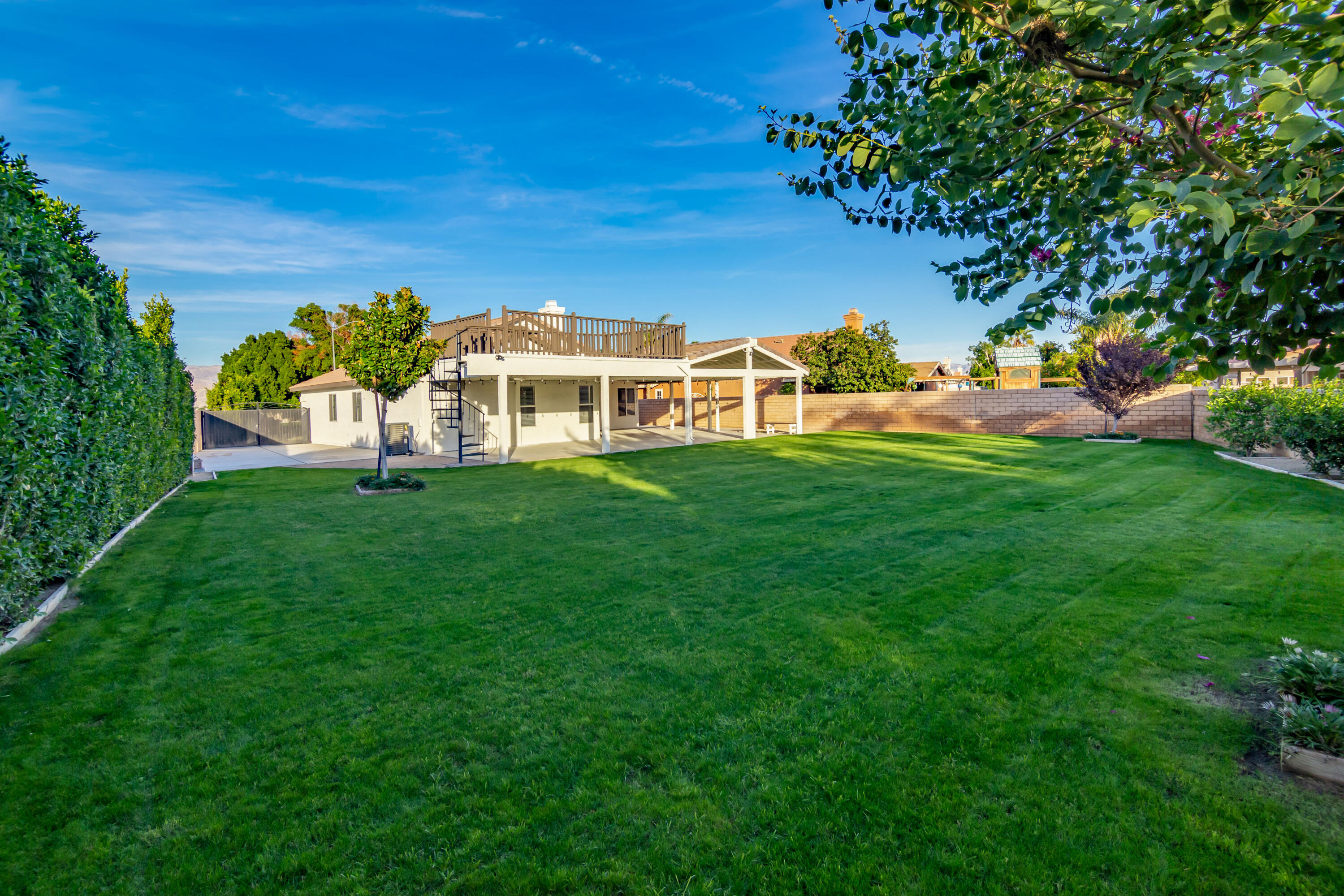80265 Moonshadow Drive Indio, CA 92201 - Photo 11 of 32 a view of a house with a big yard