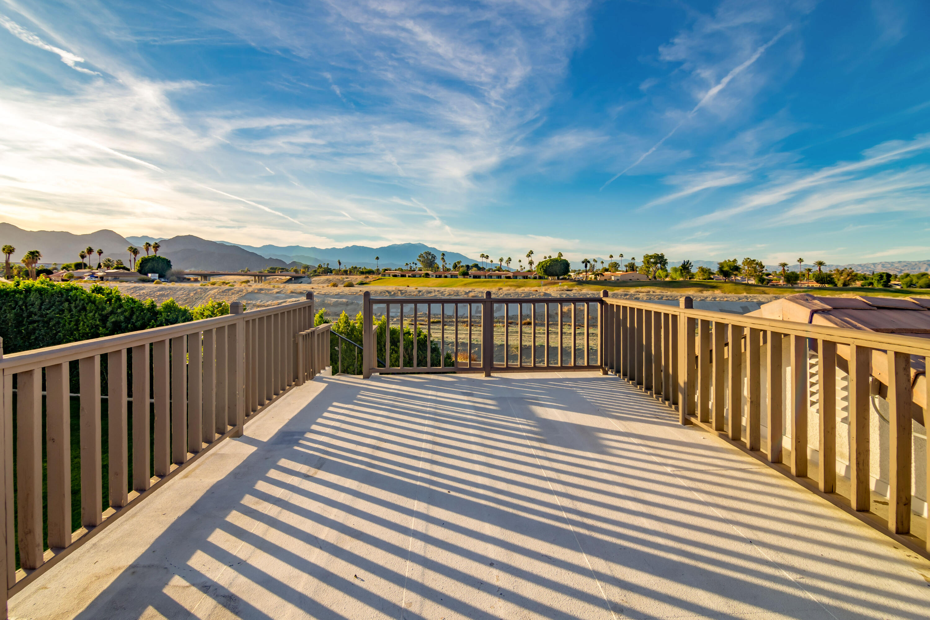 80265 Moonshadow Drive Indio, CA 92201 - Photo 15 of 32 a view of a balcony with wooden floor