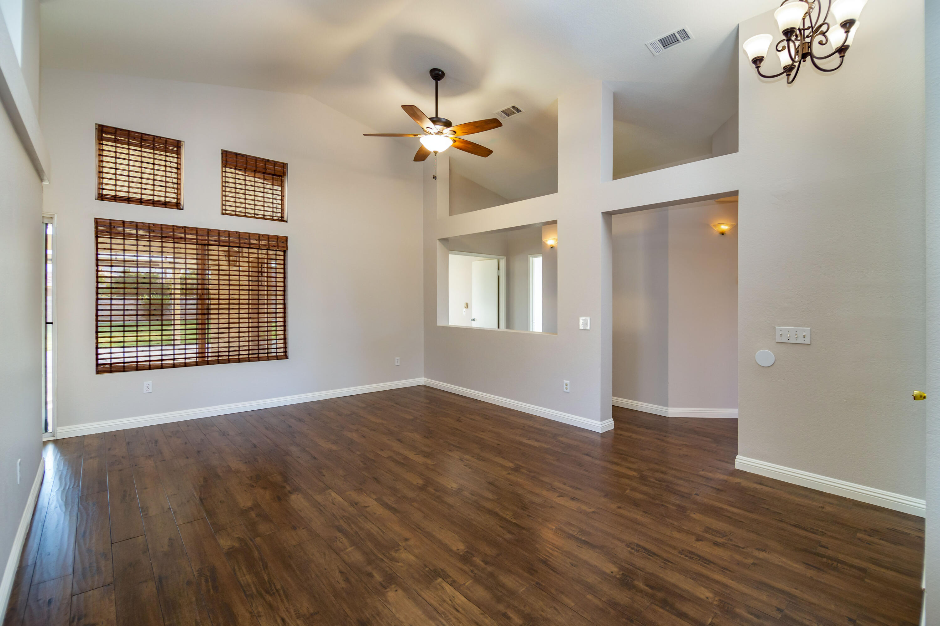 80265 Moonshadow Drive Indio, CA 92201 - Photo 19 of 32 a view of an empty room with wooden floor and a window