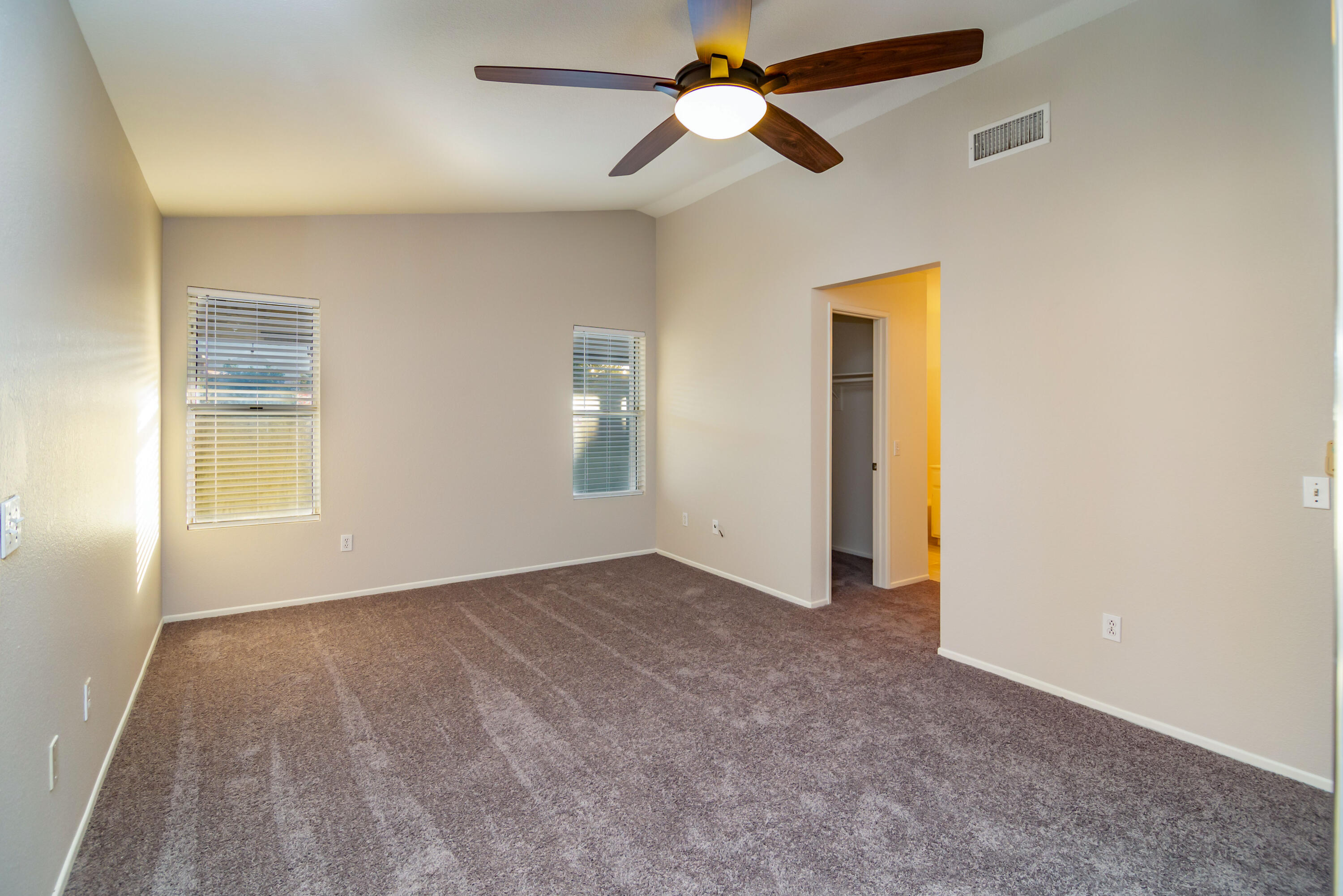 80265 Moonshadow Drive Indio, CA 92201 - Photo 30 of 32 an empty room with closet and a ceiling fan
