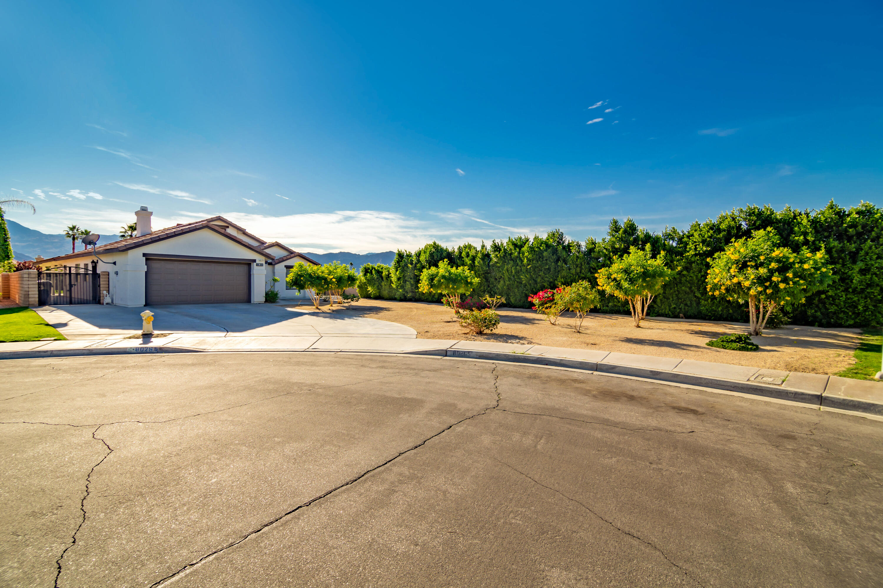 80265 Moonshadow Drive Indio, CA 92201 - Photo 7 of 32 a view of a swimming pool with an outdoor seating and a yard