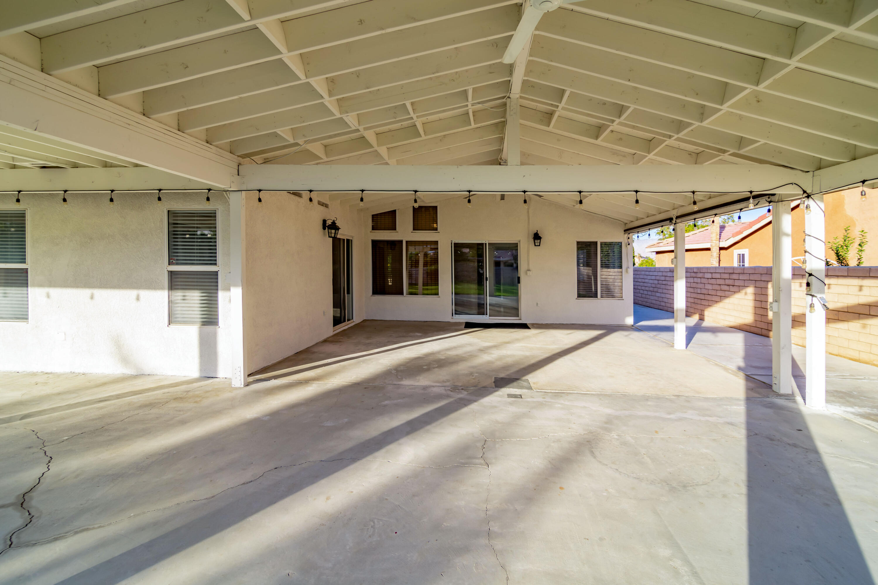 80265 Moonshadow Drive Indio, CA 92201 - Photo 9 of 32 a view of a hall with a furniture