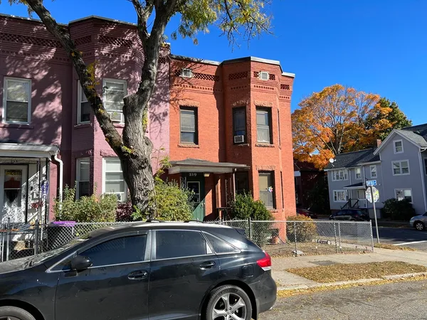 a car parked in front of a building