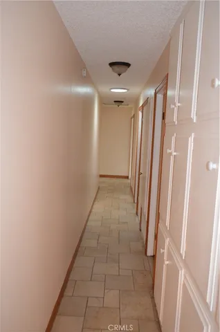 a view of a house with swimming pool and a yard