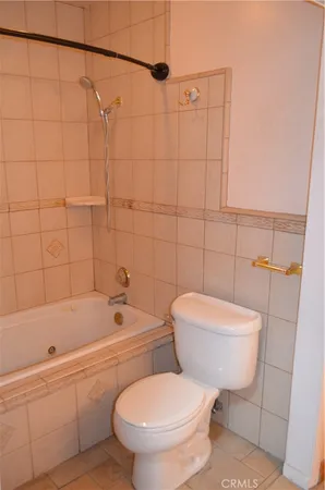 a bathroom with a toilet a sink and bathtub