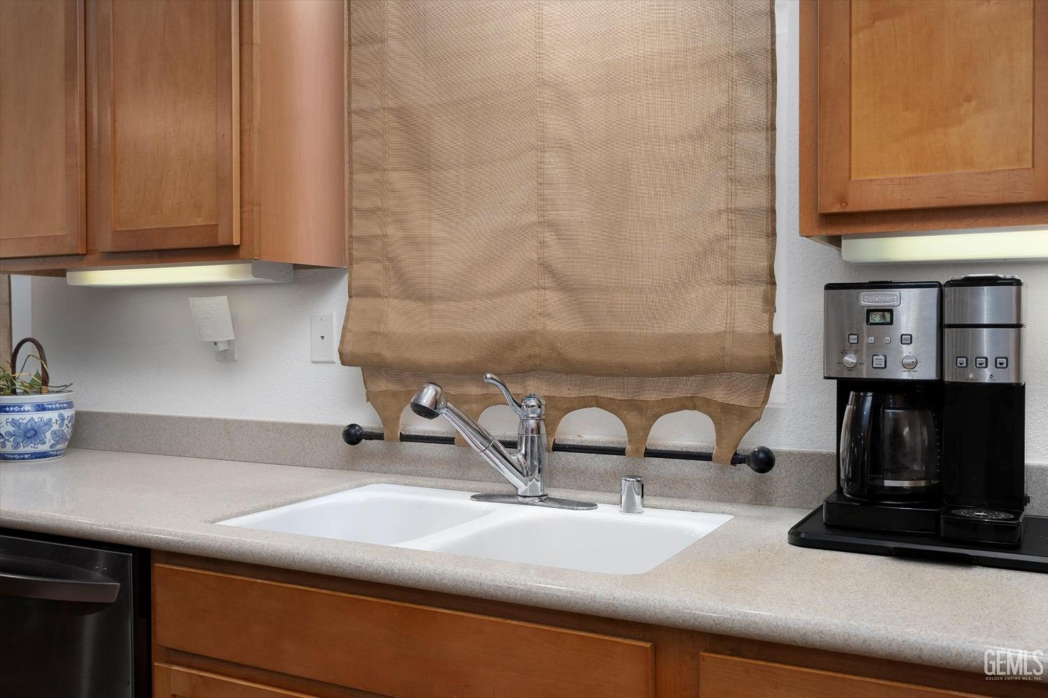 Undisclosed Address Bakersfield, CA 93306 - Photo 26 of 48 a kitchen with a sink and cabinets