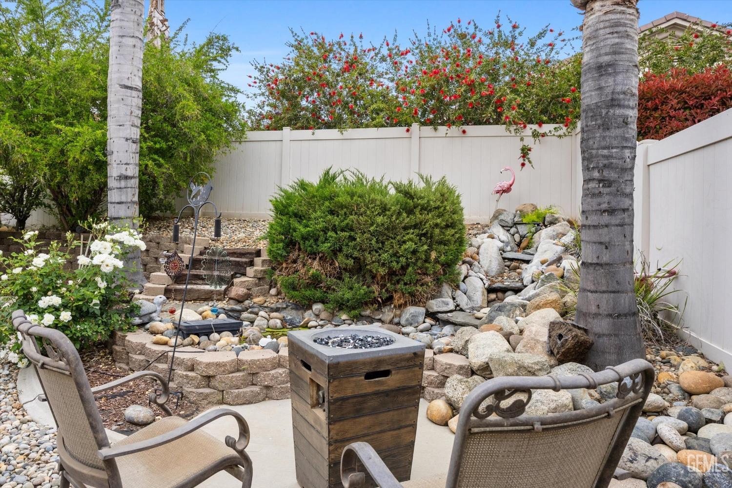 Undisclosed Address Bakersfield, CA 93306 - Photo 41 of 48 a view of a chairs and table in a backyard