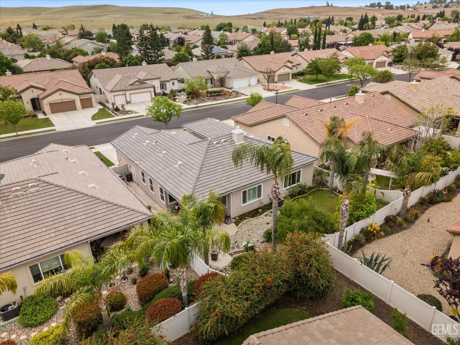 Undisclosed Address Bakersfield, CA 93306 - Photo 7 of 48 an aerial view of residential houses with outdoor space