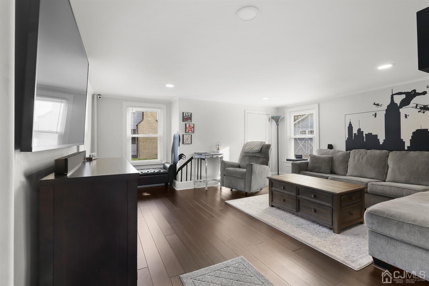 385 Ridge Road Dayton, NJ 08810 - Photo 14 of 29 a living room with furniture wooden floor and a large window