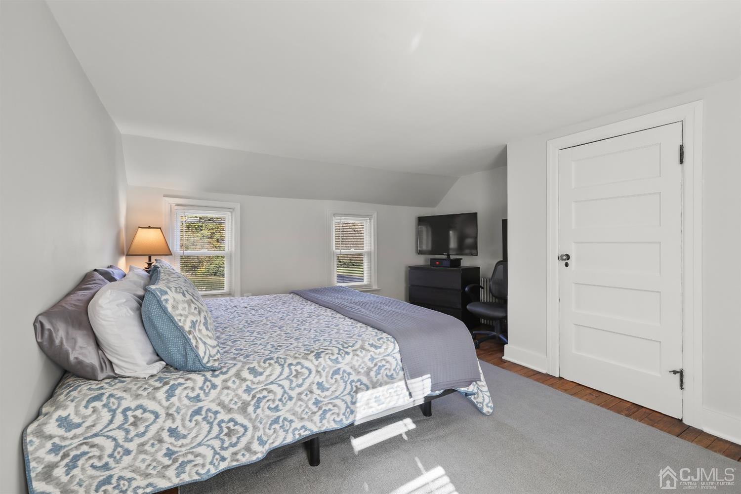 385 Ridge Road Dayton, NJ 08810 - Photo 17 of 29 a bedroom with a large bed and a closet