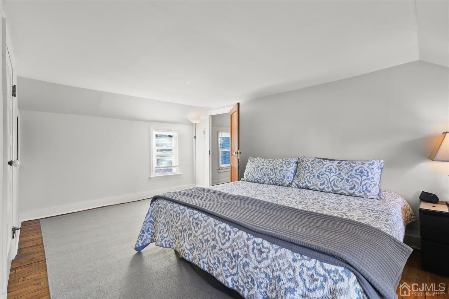 385 Ridge Road Dayton, NJ 08810 - Photo 18 of 29 a bedroom with a bed and a couch