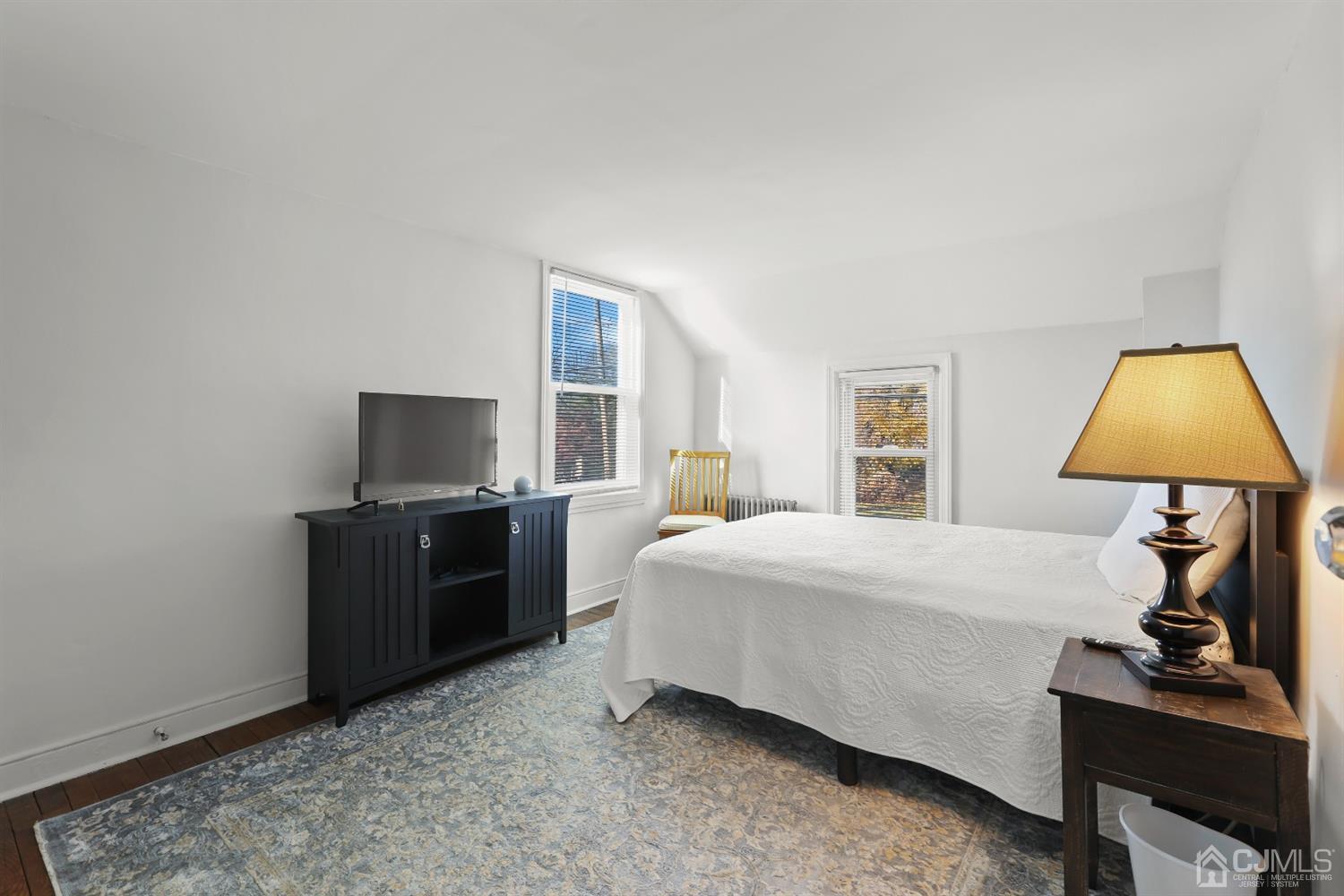 385 Ridge Road Dayton, NJ 08810 - Photo 20 of 29 a bedroom with a bed and a flat screen tv