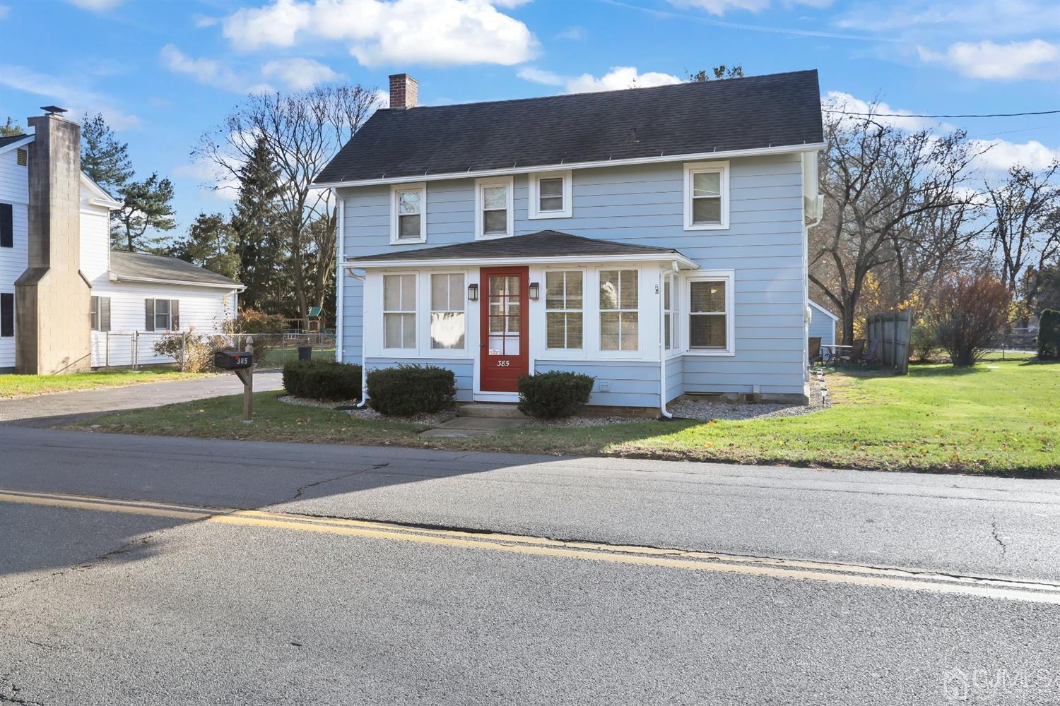 385 Ridge Road Dayton, NJ 08810 - Photo 3 of 29 front view of a house with a street