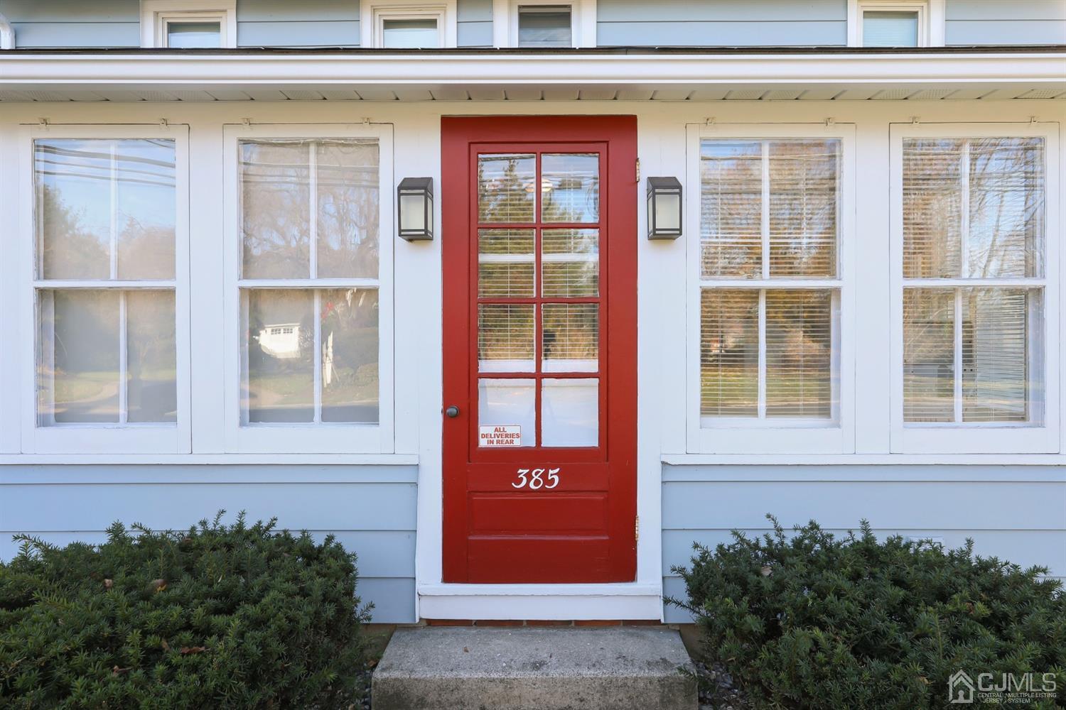 385 Ridge Road Dayton, NJ 08810 - Photo 4 of 29 a front view of a house with a yard