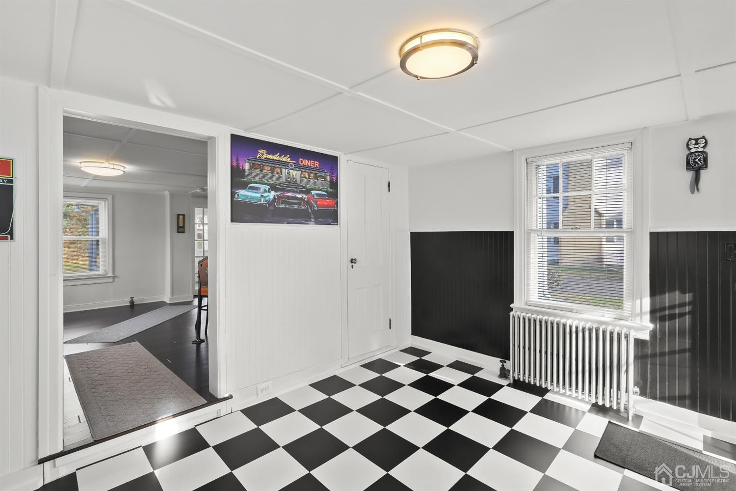 385 Ridge Road Dayton, NJ 08810 - Photo 6 of 29 a view of a room with a black and white checkered floor