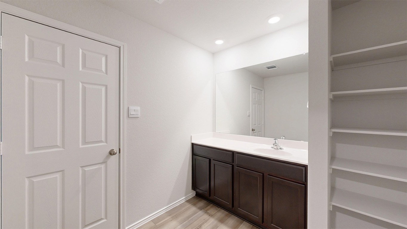 6801 Gilbert Drive Killeen, TX 76549 - Photo 9 of 27 a bathroom with a double vanity sink and a mirror