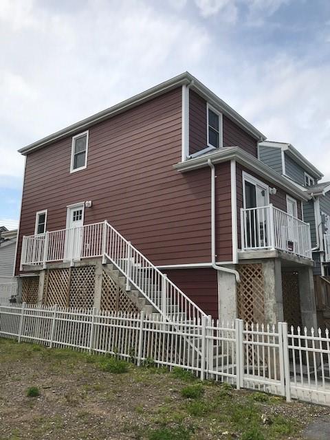 19 Stanton Road Brooklyn, NY 11235 - Photo 2 of 12 a front view of a house with a yard