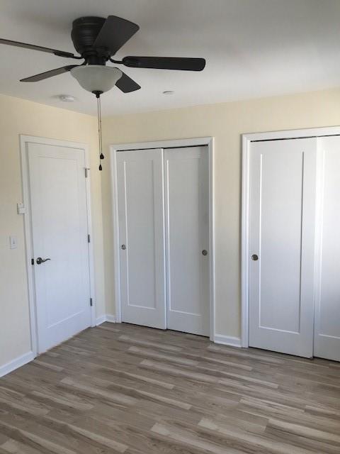 19 Stanton Road Brooklyn, NY 11235 - Photo 5 of 12 a view of a livingroom with a chandelier fan and wooden floor