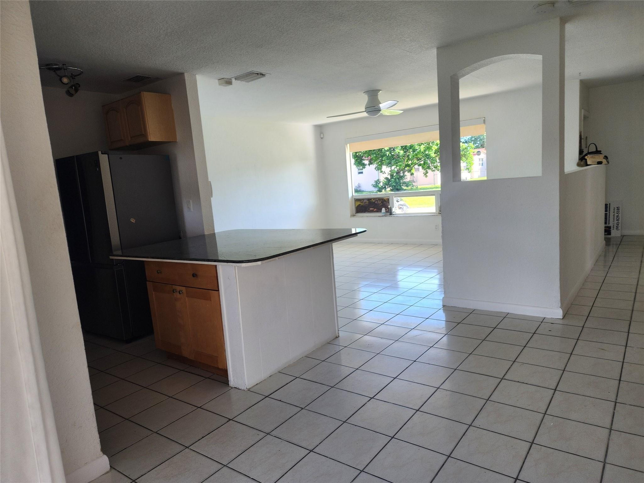 704 Southwest 4th Street Hallandale Beach, FL 33009 - Photo 13 of 33 an empty room with windows