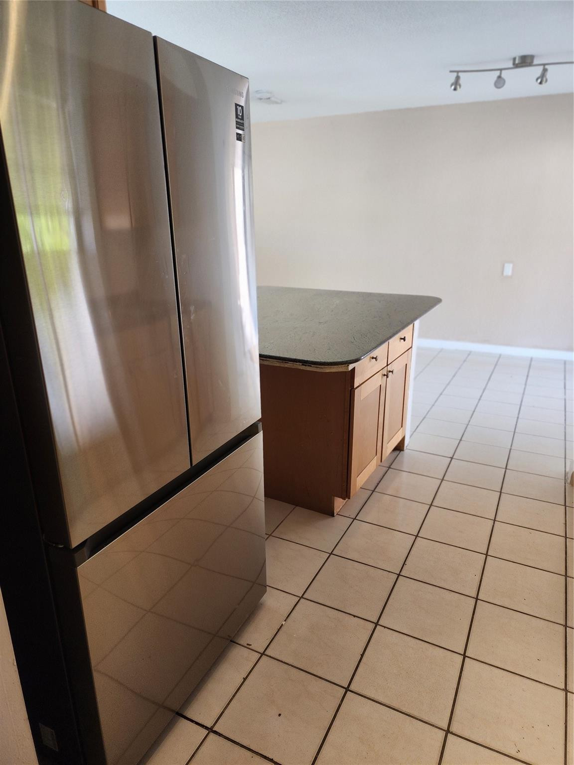 704 Southwest 4th Street Hallandale Beach, FL 33009 - Photo 14 of 33 a view of an empty room with wooden floor