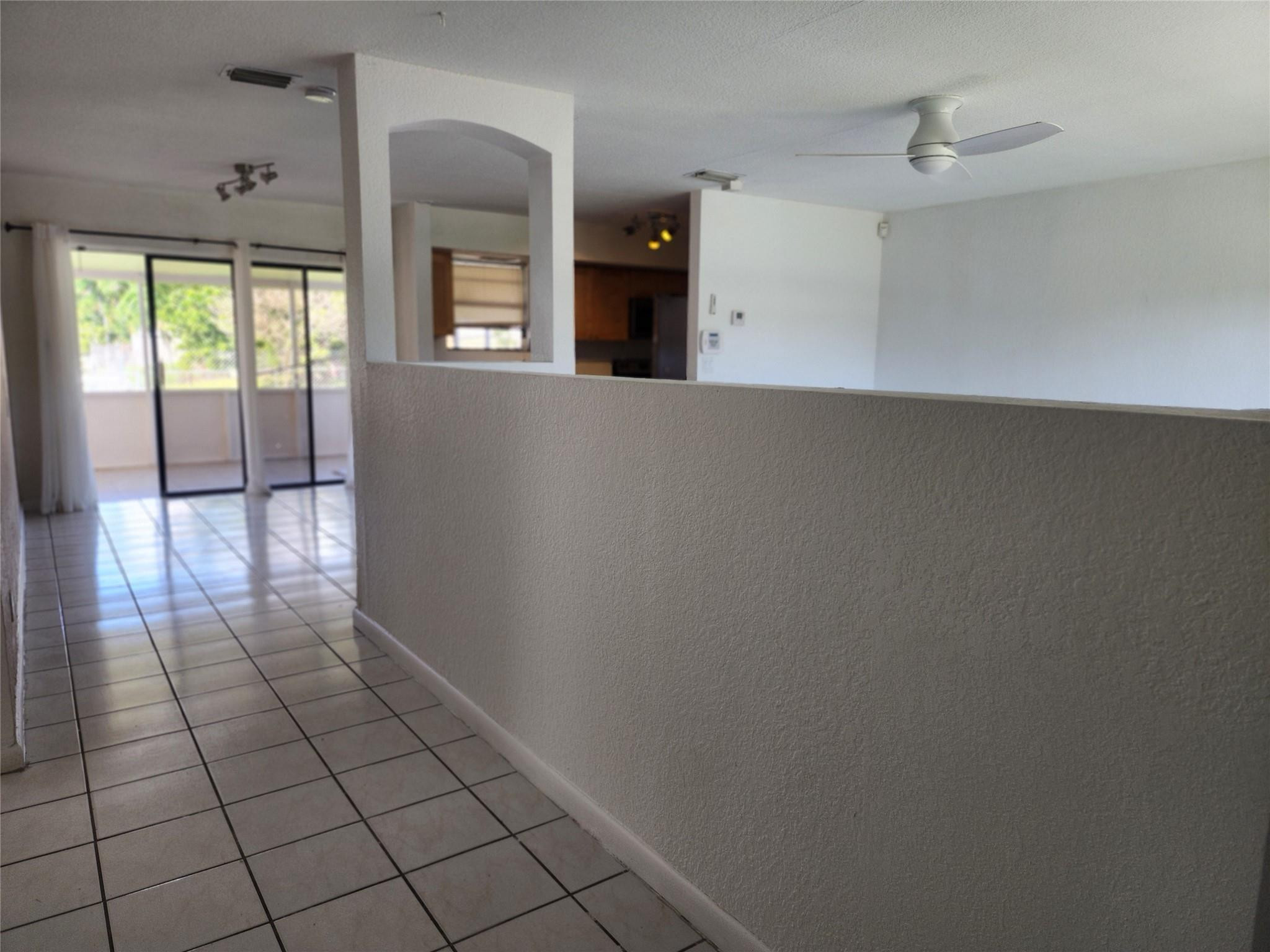 704 Southwest 4th Street Hallandale Beach, FL 33009 - Photo 19 of 33 wooden floor in an empty room with a window