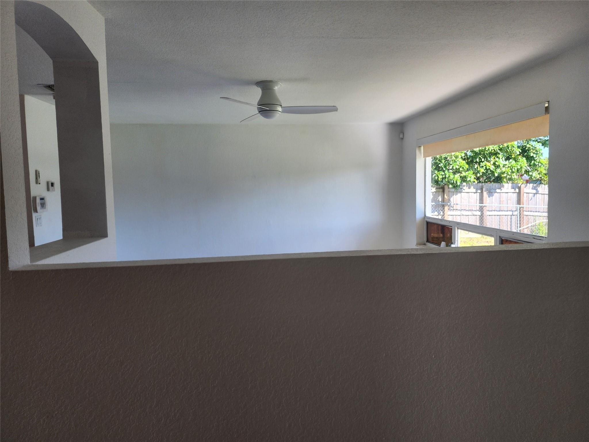 704 Southwest 4th Street Hallandale Beach, FL 33009 - Photo 20 of 33 an empty room with a window