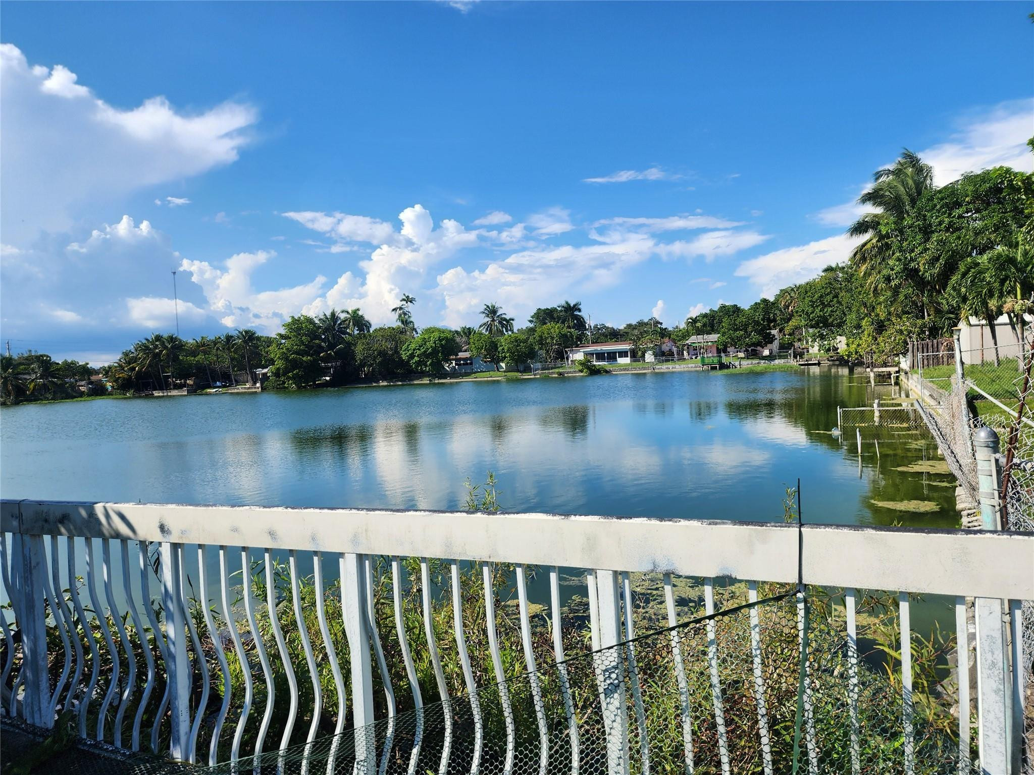 704 Southwest 4th Street Hallandale Beach, FL 33009 - Photo 2 of 33 a view of a lake from a balcony