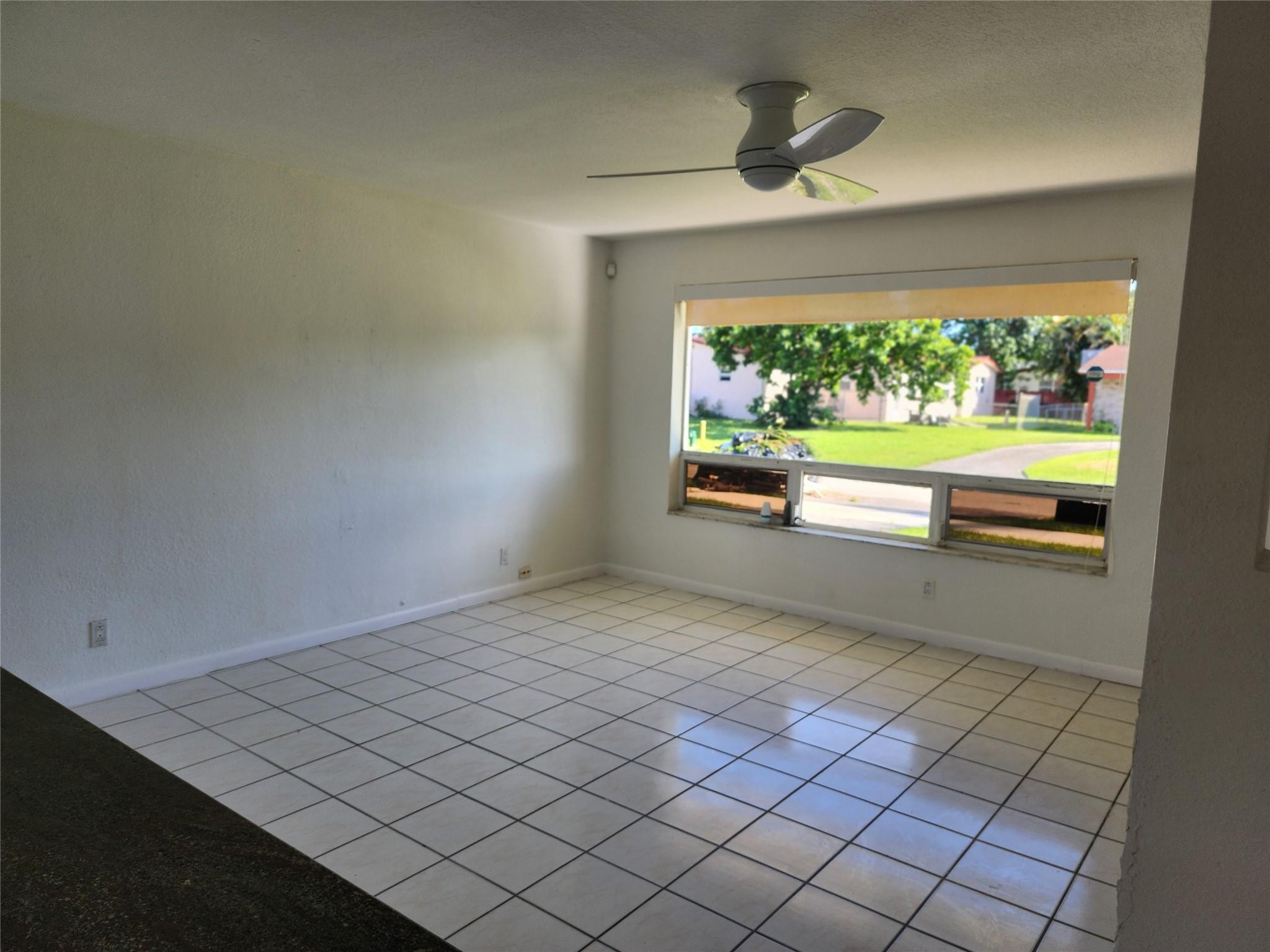 704 Southwest 4th Street Hallandale Beach, FL 33009 - Photo 24 of 33 a view of empty room with wooden floor and fan
