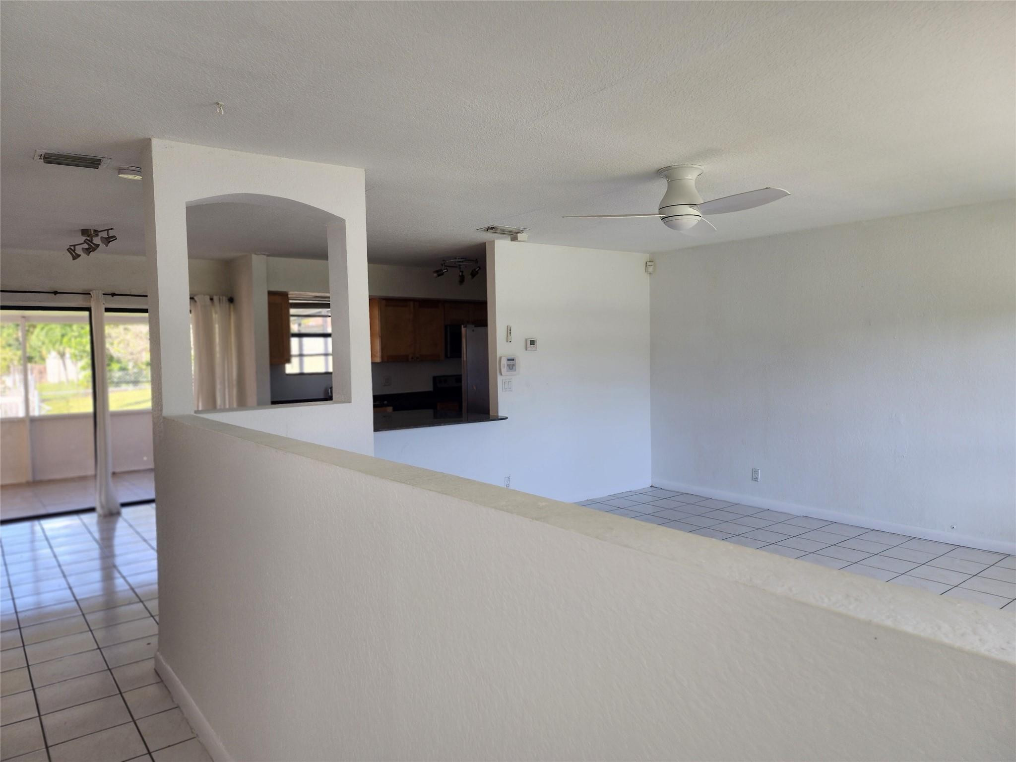 704 Southwest 4th Street Hallandale Beach, FL 33009 - Photo 29 of 33 a view of an empty room with glass door