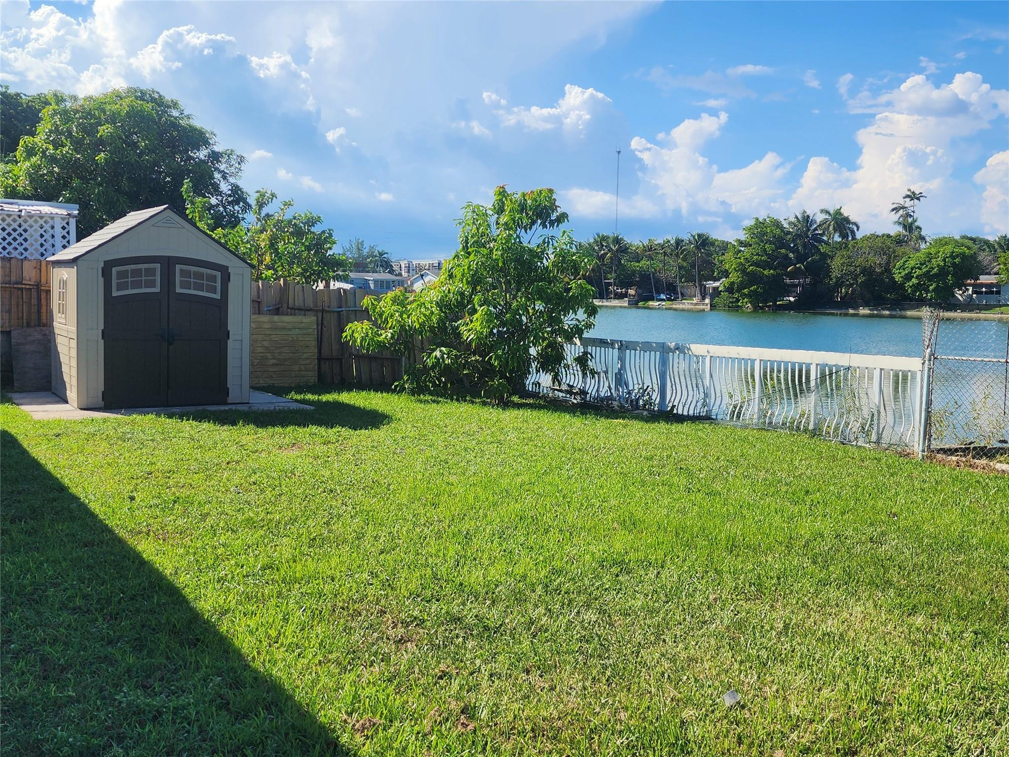 704 Southwest 4th Street Hallandale Beach, FL 33009 - Photo 9 of 33 a view of a back yard with green space