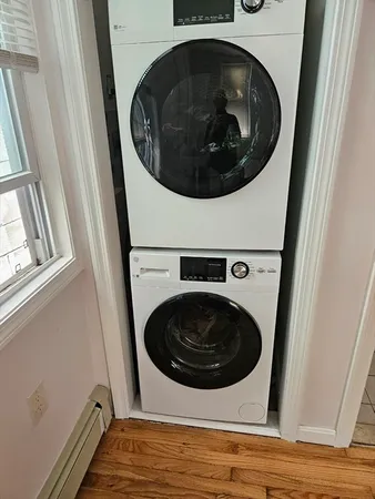 a utility room with dryer and washer