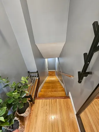 a view of a room with wooden floor
