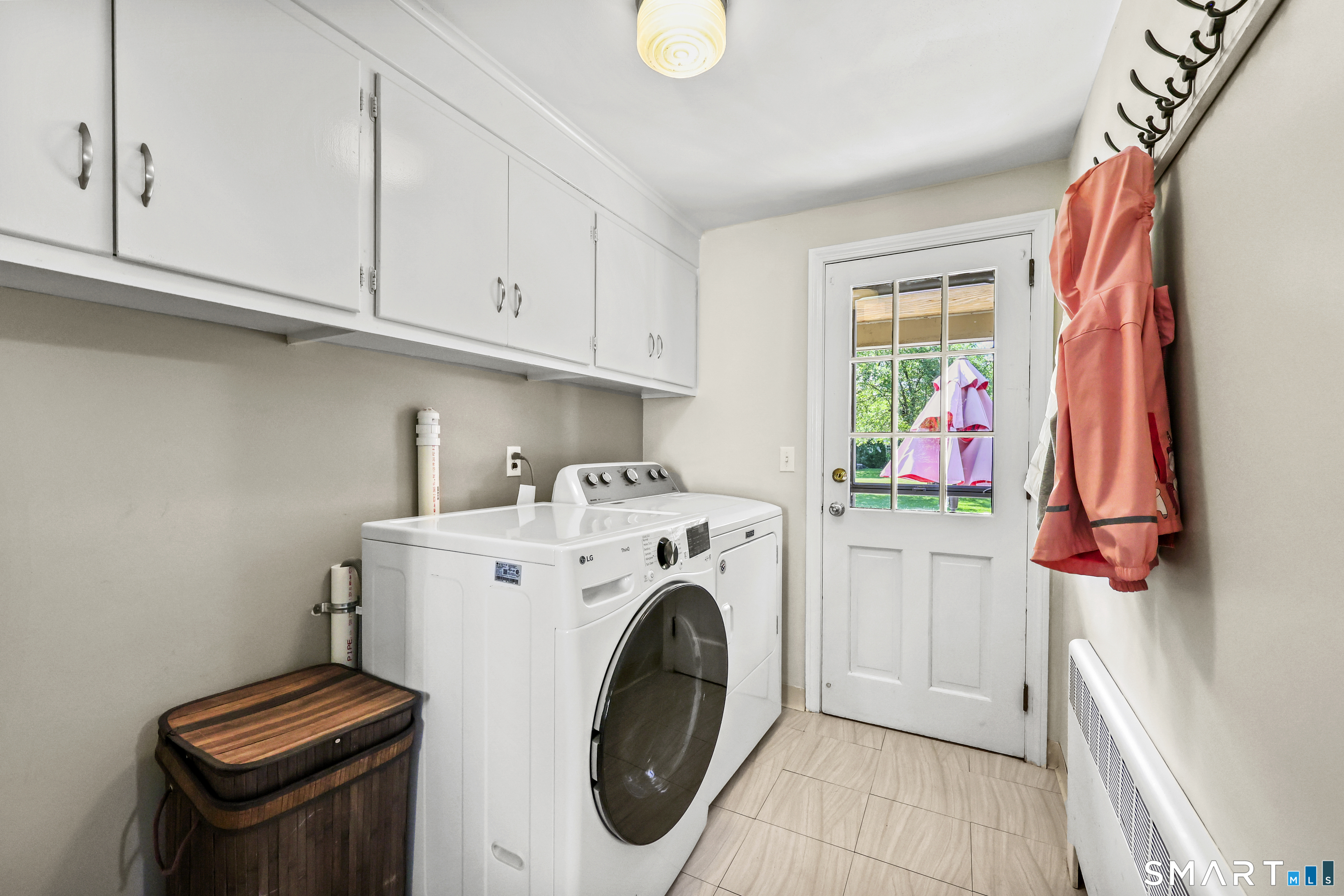 73 Longlane Road West Hartford, CT 06117 - Photo 11 of 30 Laundry Conveniently Positioned in Hallway Off Kitchen
