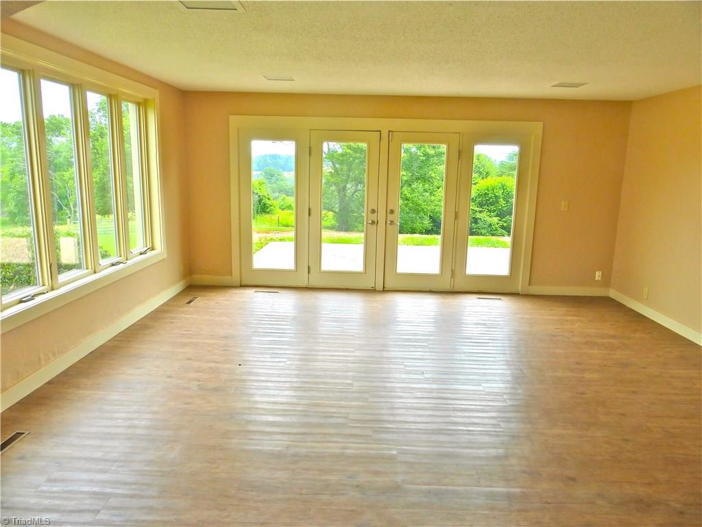 470 Crossingham Road Mount Airy, NC 27030 - Photo 12 of 30 Sun/Recreation room off living room, looking at back patio