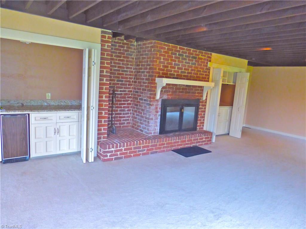 470 Crossingham Road Mount Airy, NC 27030 - Photo 13 of 30 living room fireplace with minibar