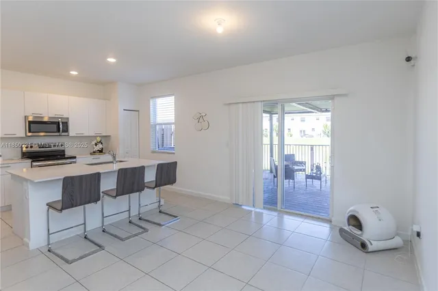 a view of kitchen with breakfast area
