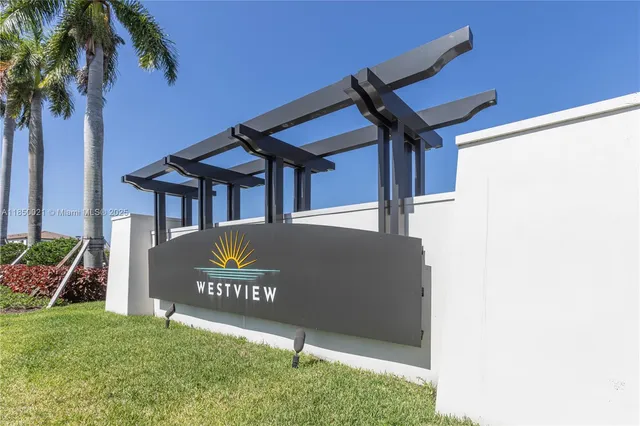 a view of a sign board with a small yard