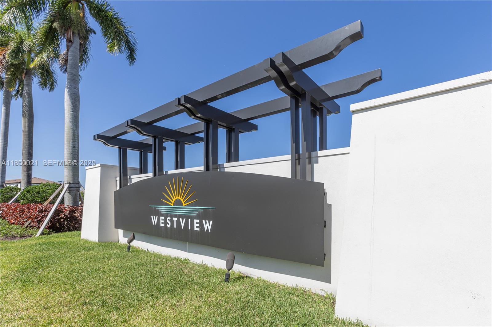 12561 Northwest 23rd Place Miami, FL 33167 - Photo 2 of 45 a view of a sign board with a small yard