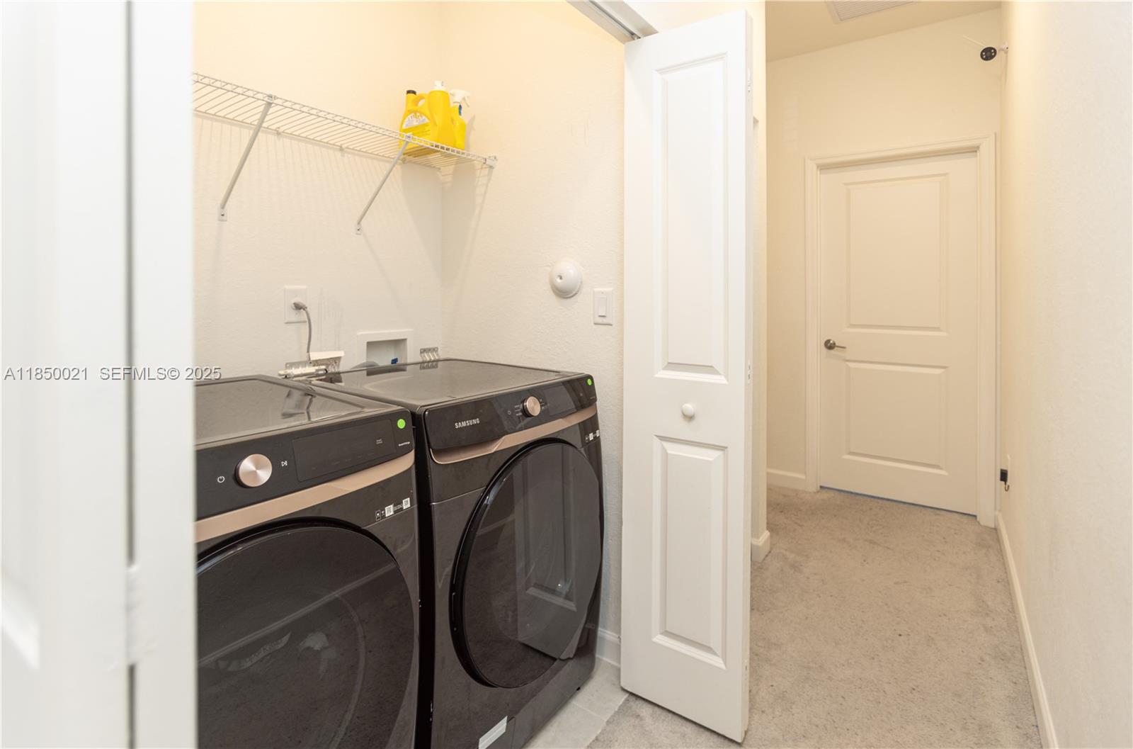 12561 Northwest 23rd Place Miami, FL 33167 - Photo 24 of 45 a utility room with dryer and washer