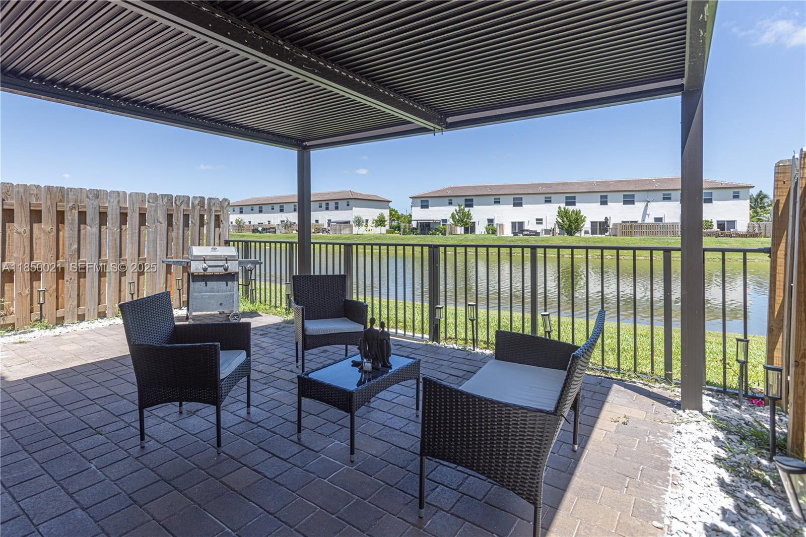 12561 Northwest 23rd Place Miami, FL 33167 - Photo 33 of 45 a building outdoor space with patio furniture