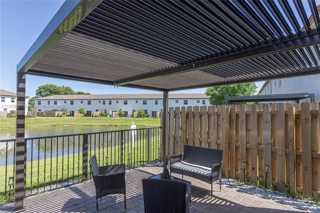 a view of a swimming pool with a lake view