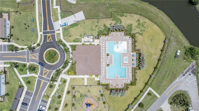 an aerial view of a house with a swimming pool