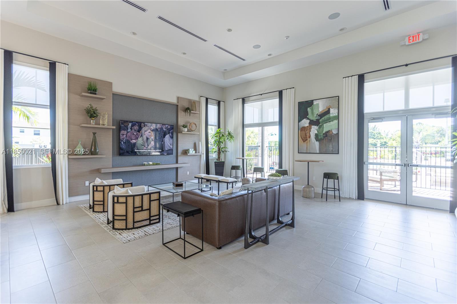 12561 Northwest 23rd Place Miami, FL 33167 - Photo 39 of 45 a living room with furniture and large windows