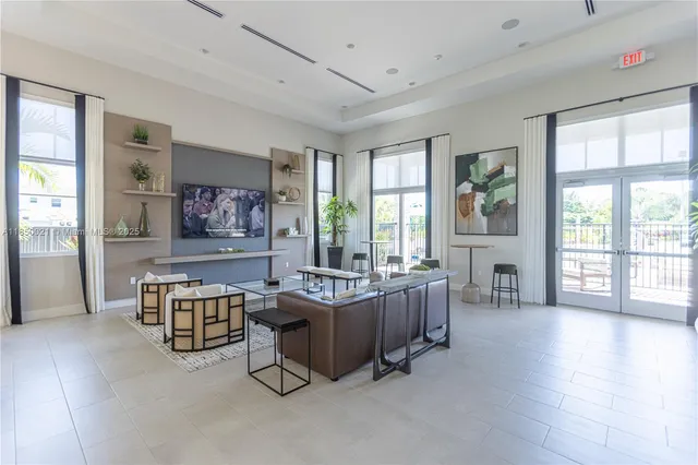 a kitchen with stainless steel appliances a sink and cabinets