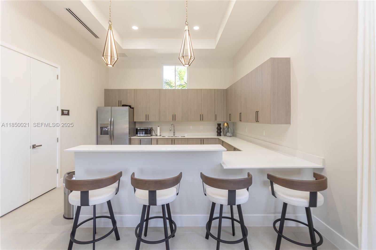 12561 Northwest 23rd Place Miami, FL 33167 - Photo 40 of 45 a kitchen with stainless steel appliances a sink and cabinets